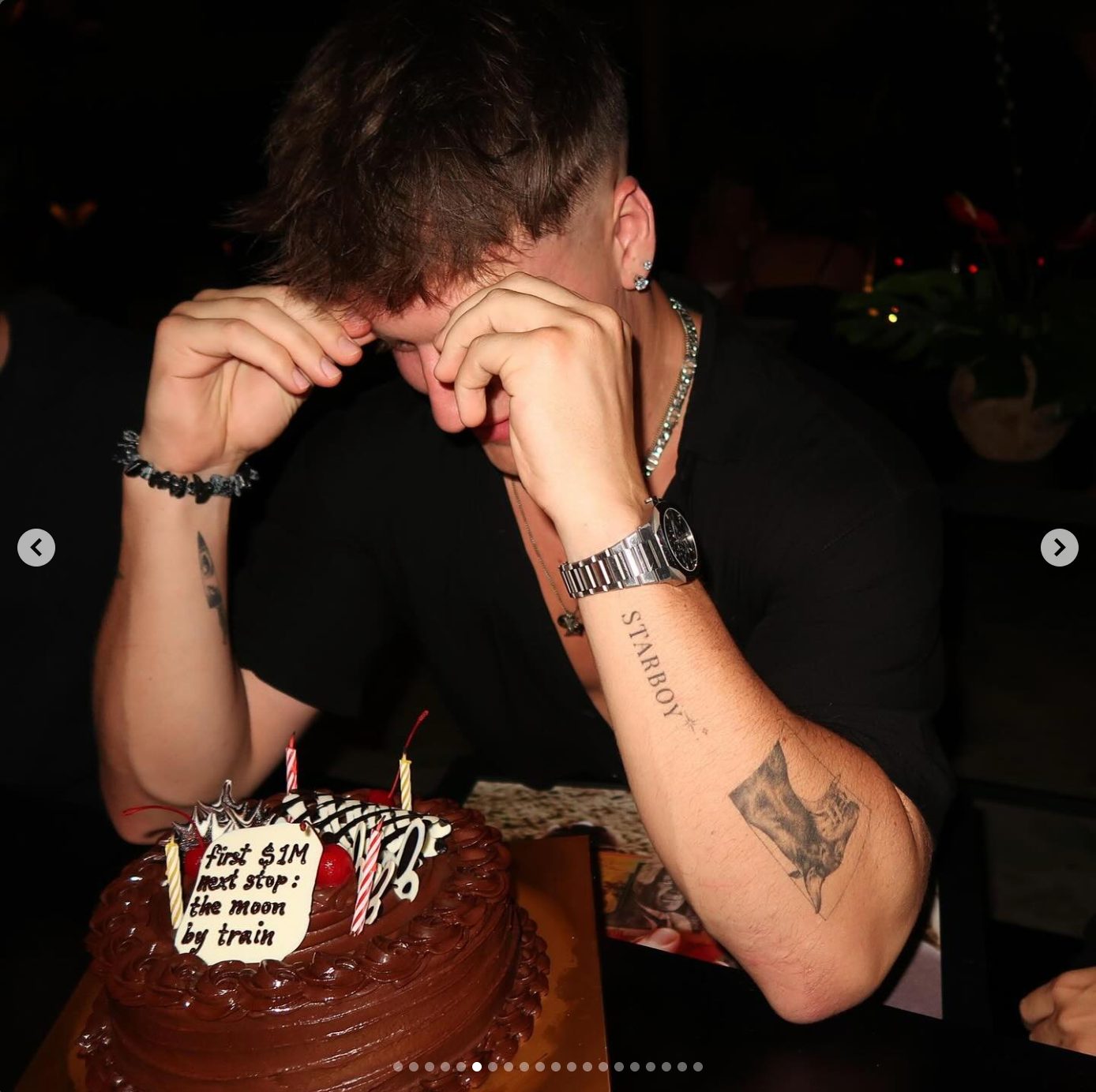 Lachie celebrating the first million-dollar month with a cake
