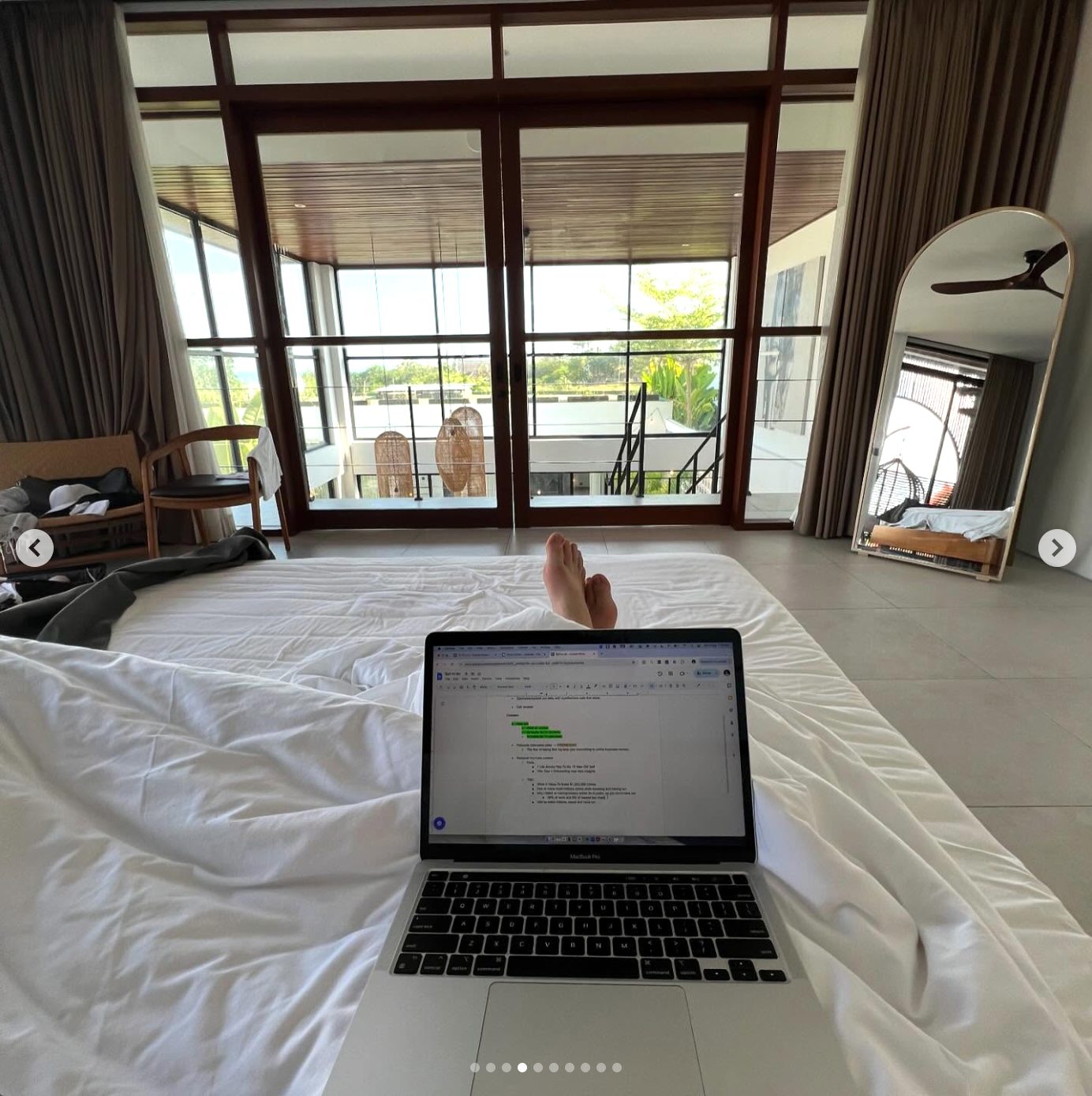 Lachie working from the villa bed in Bali
