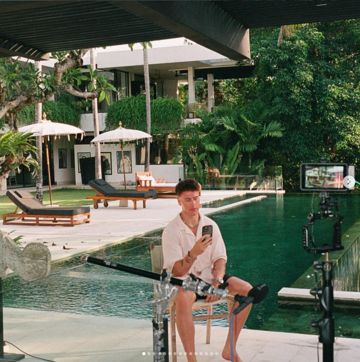 Lachie filming poolside in Bali