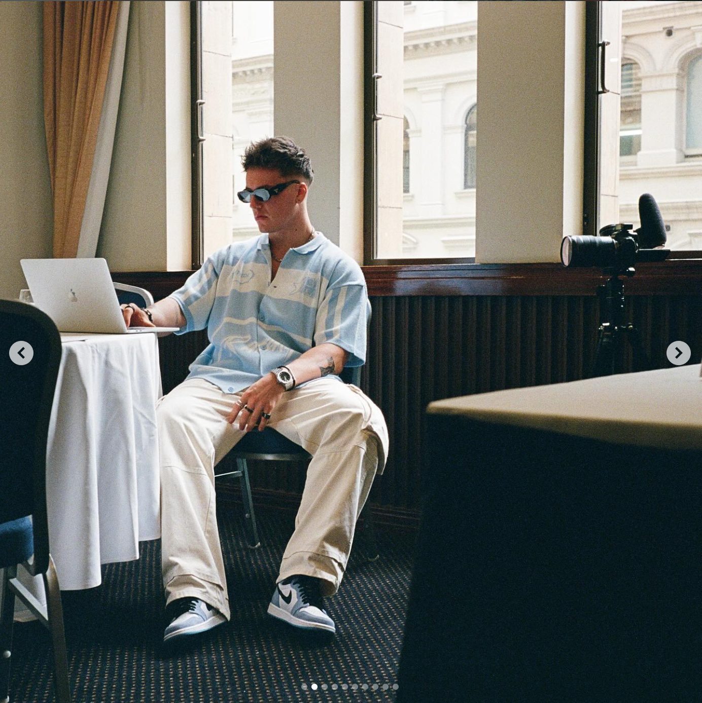 Lachie working from his laptop at an event in Sydney