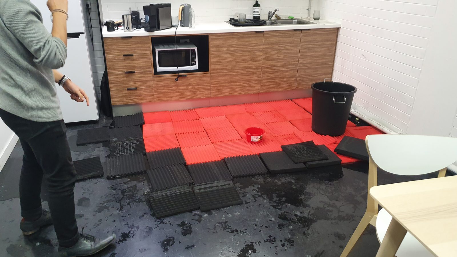 Acoustic foam laid over the flooded office floor